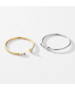 Detail of S925 silver adjustable rings with gold finish and inlaid zircon stones