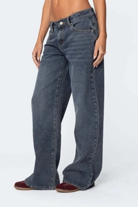 Detail view of baggy low-rise wide-leg denim jeans in dark grey blue wash fabric