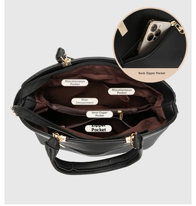 Detail view of the black leather bag interior showing multiple organized compartments and pockets