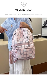 Detail showing pink plaid school backpack with matching pencil case and cute rabbit graphics