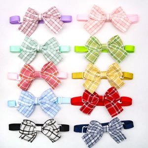 Set of 10 plaid pet bow ties in various vibrant colors with white plastic buckles