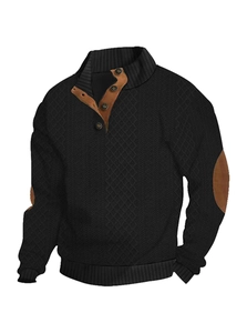 Detail of men's black knit sweater featuring brown leather elbow patches and buttoned collar