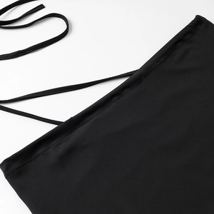 Detail of black sexy set showing fine stitching and flexible knit fabric with tie strings