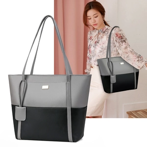 Minimalist grey and black contrast soft leather tote bag with long shoulder strap