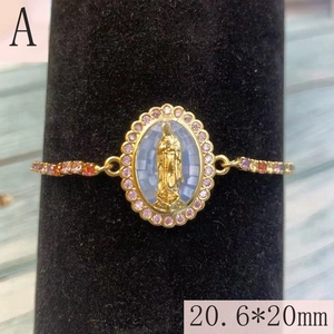 Macro detail of gold Virgin Mary charm with purple zircon stones and 20.6*20mm size scale