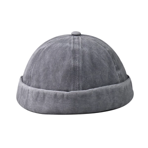 Close-up of vintage washed dark gray denim miki hat with rolled edge and texture
