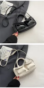 Detailed view of vintage saddle bags in black and cream with functional front pockets