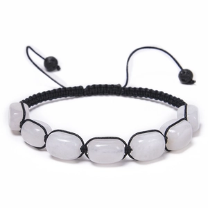 Macro detail of handmade woven bracelet with seven natural translucent stones on white