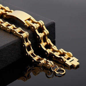 Men's gold bicycle chain style bracelet in stainless steel with a minimalist industrial look