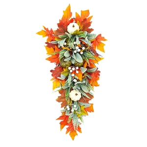 Autumn harvest swag with colorful maple leaves and white pumpkins for home decor