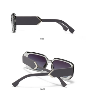 Detail of square retro sunglasses featuring grey frames and wavy temple design