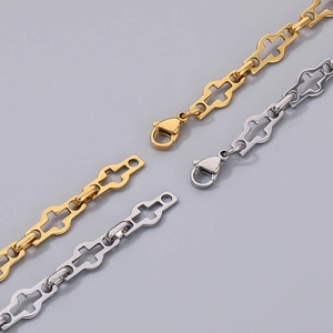 Detail of stainless steel cross chain necklaces in gold and silver finish with lobster clasp