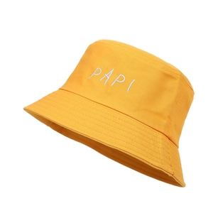 Detail of yellow cotton bucket hat with white PAPI embroidery and reinforced stitching