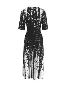 Detail of short-sleeved dress featuring black and white abstract splash ink print