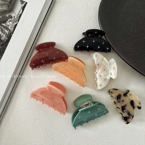 Macro shot of assorted ice cream color hair clips with sparkling rhinestones decoration