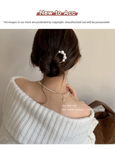 U-shaped hair pin with pearls and matching delicate necklace shown on a model hair