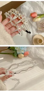 Detailed view of double-row pearl headband and crystal beaded floral hair accessory
