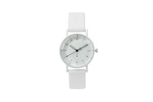 Close-up of white silicone strap and minimalist round dial on a quartz wristwatch