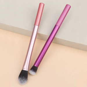 Detail of gradient metallic makeup brushes with soft bicolor synthetic fibers