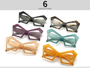 Flat lay of hexagonal cat eye blue light glasses in six assorted fashion colors