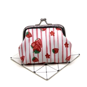 Close-up of strawberry print coin purse with vintage silver metal clasp closure
