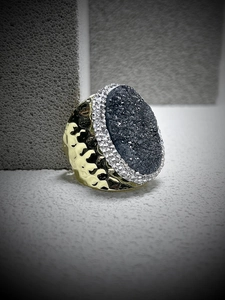 Detailed view of bronze wide adjustable ring with grey druzy stone and crystal accents