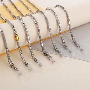 Detailed view of various stainless steel eyeglass chains with silicone anti-slip loops