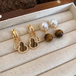 Vintage tiger eye stone and pearl drop earrings in a luxury jewelry display box