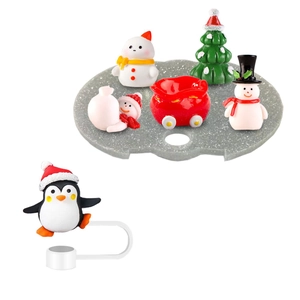 Christmas themed resin miniatures set with penguin, snowman and tree on grey base
