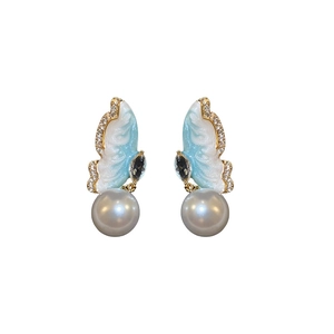 Elegant butterfly drop earrings with blue enamel, sparkling crystals and white pearls