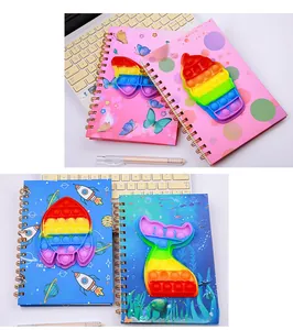 Detail view of A5 spiral notebooks with rainbow silicone pop fidget covers for stress relief