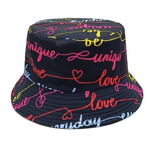 Detail of black bucket hat with colorful unique art lettering and street style graffiti