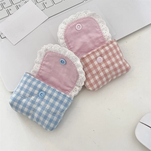 Detailed view of sky blue and pink checkered lace pouch for earphones with snap button