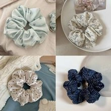 Detailed four-grid view showing various floral and polka dot fabric scrunchie hair ties