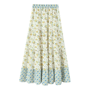 Bohemian floral tiered maxi skirt with high elastic waist and yellow print on white fabric