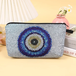 Portable evil eye pattern cosmetic bag with blue mosaic design and black zipper
