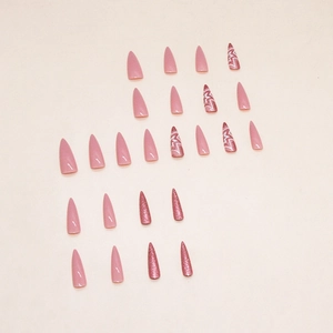 Pink stiletto press-on nails set with glitter and star design for elegant manicure