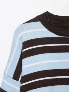 Detail shot of striped knit sweater showing ribbed crew neck and shoulder texture