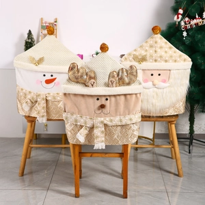 Christmas chair covers featuring Santa, Reindeer and Snowman patterns in gold and beige
