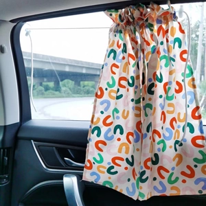 Car side window sunshade with colorful geometric U-shaped pattern and drawstring detail
