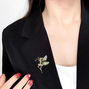 Exquisite dancing fairy brooch with green gradient wings on black blazer lapel