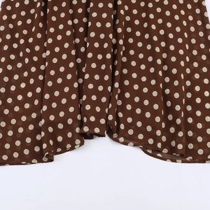 Elegant brown polka dot long dress with pleated design and fluid hem details