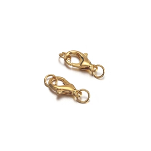 Macro shot of gold-plated lobster clasps with matching jump rings on white background