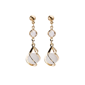 Elegant gold drop earrings with crystal and white spiral beads on a clean white background