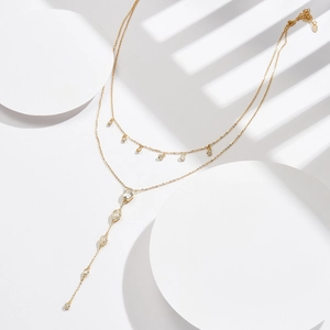 Double-layered gold necklace with water drop zircons and round diamond pendants