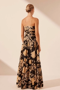 Detail of a strapless floral maxi dress with retro print and premium fabric texture