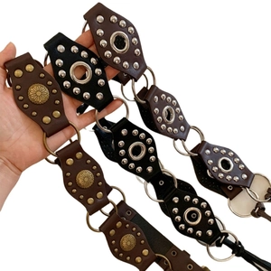 Three styles of vintage leather belts with geometric hollow rivets and boho buckle details