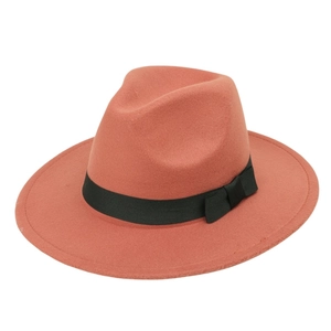 Detail of wide brim wool fedora hat in caramel with a black ribbon bow decoration