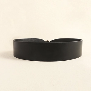Elegant wide black leather belt for dresses with a polished gold metallic buckle