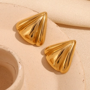 Close-up of geometric triangular stud earrings in 18K gold plated stainless steel
